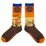 Flight Outfitters High Desert Socks featuring a bush plane flying over desert landscape