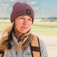 Woman wearing orange Flight Outfitters Beanie Winter Hat, showing fit and style