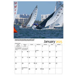 Open view of Sailing to the Mark 2025 Calendar displaying monthly layout and sailing images