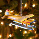 The Flight Outfitters Seaplane Christmas Ornament displayed on a Christmas tree, adding aviation charm to holiday decor.