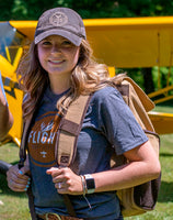 A woman wearing the Flight Outfitters Bush Pilot Rucksack, showcasing its comfortable and stylish design.