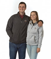  A man and woman wearing the Flight Outfitters Fairbanks Fleece, showcasing the men’s and ladies’ designs.