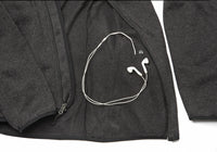 Interior view of the Fairbanks Fleece’s pocket with a pass-through headphone cable port for hands-free convenience.