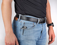 The Flight Outfitters Pilot Survival Knife shown securely stored in a pocket, emphasizing portability.