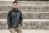 A man wearing the Flight Outfitters Men's Kodiak Jacket, demonstrating its versatile and stylish look in a real-world setting.