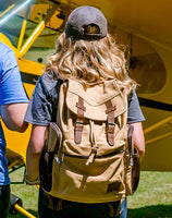 Woman wearing the Flight Outfitters Bush Pilot Rucksack, demonstrating its versatility.