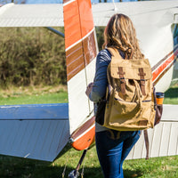 Woman wearing the Flight Outfitters Bush Pilot Rucksack, demonstrating its versatility.